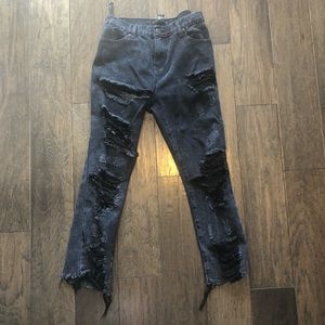Distressed black jeans with slit under butt